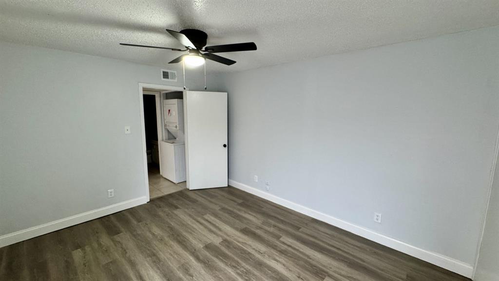 5616 Boca Raton Boulevard, Unit 238 Fort Worth, TX 76112 - Photo 9 of 11 wooden floor in an empty room