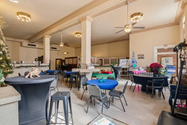 a room with wooden floor and pool table