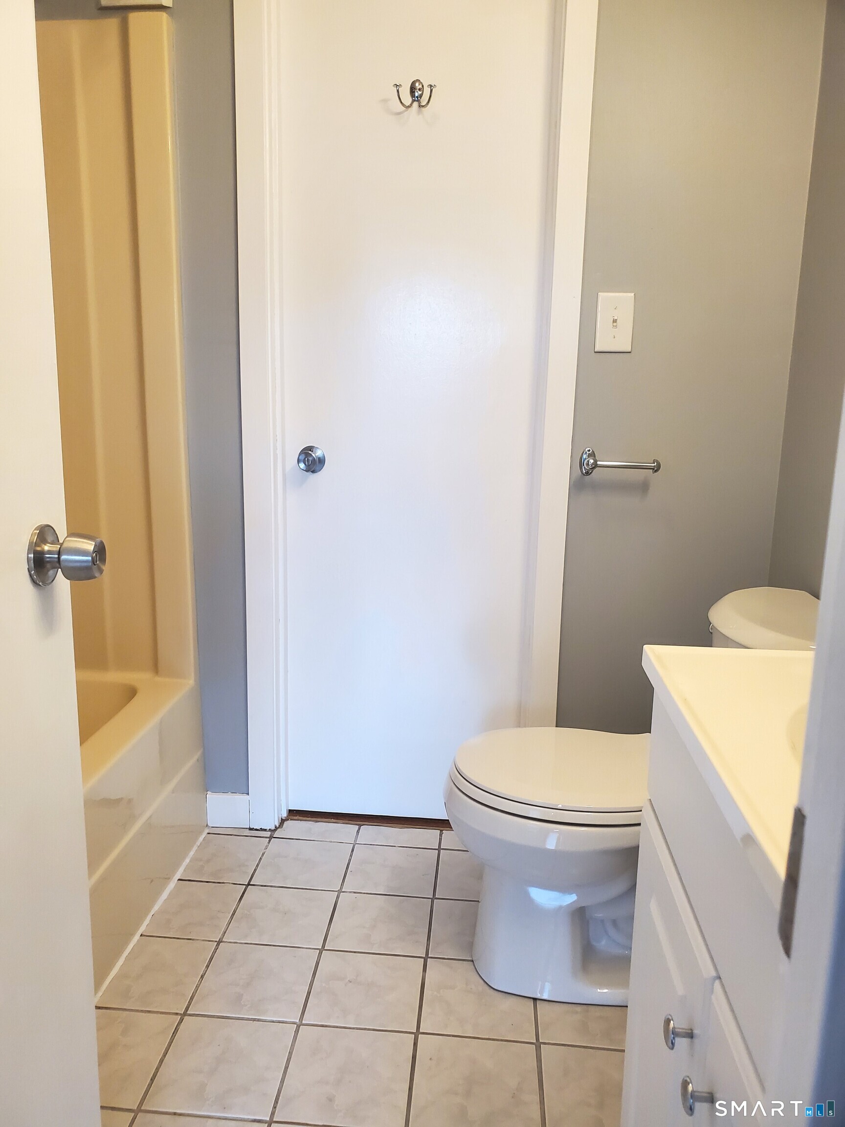 137 Knowles Avenue, Unit 137 Middletown, CT 06457 - Photo 10 of 13 a white toilet sitting next to a bath tub