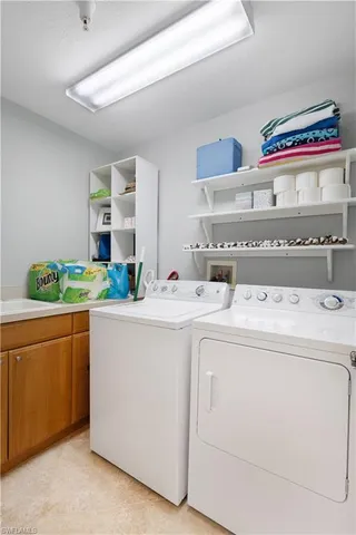 a utility room with washer and dryer