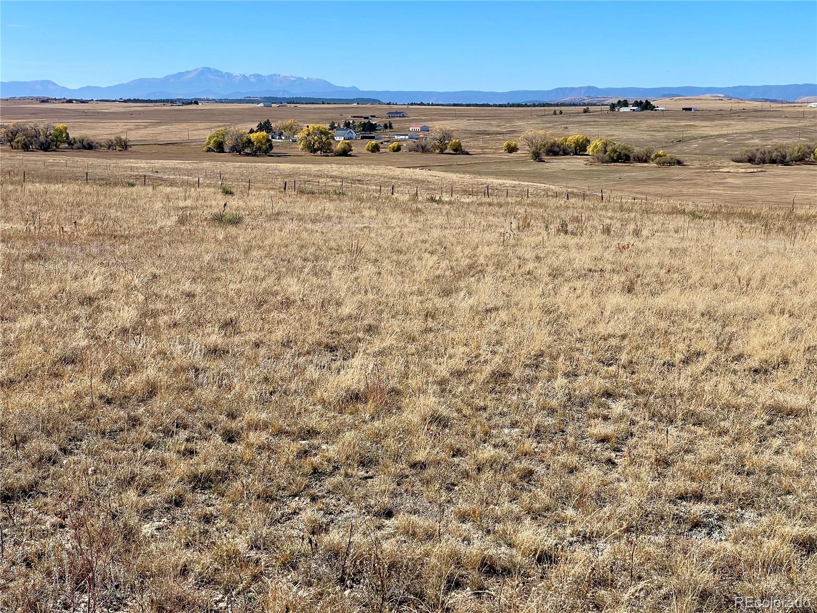 Cave Spring Trail Elbert, CO 80106 - Photo 4 of 14 a view of a field with wooden fence
