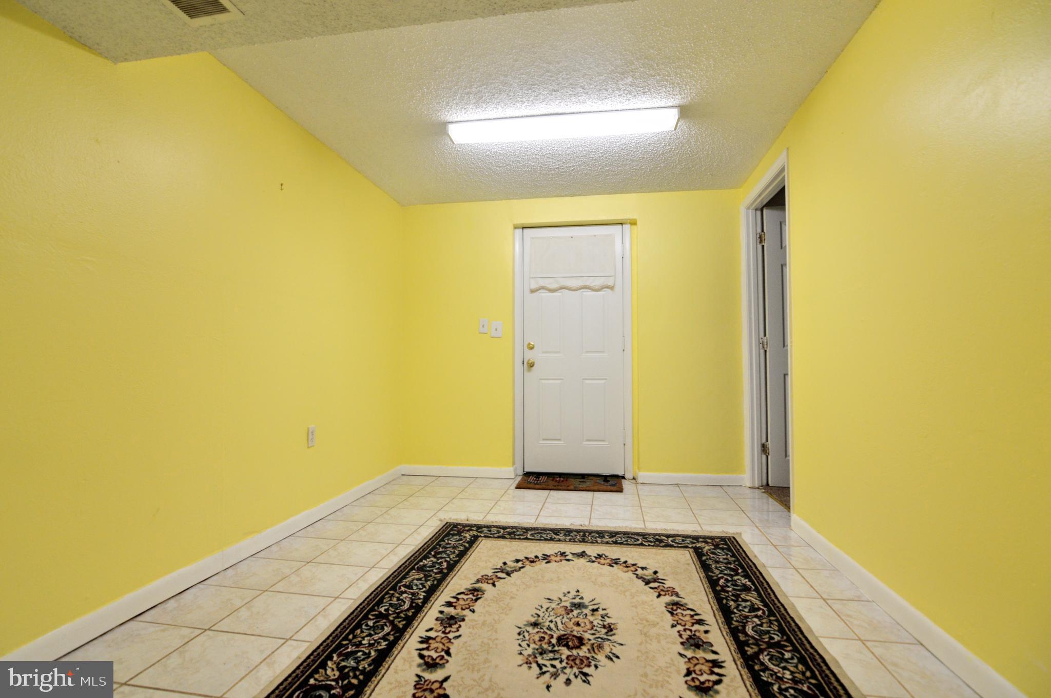 6802 Killarney Street Clinton, MD 20735 - Photo 2 of 19 a view of an empty room with a window