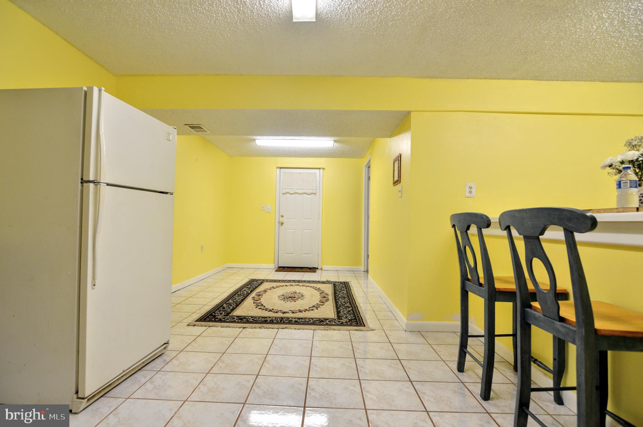 6802 Killarney Street Clinton, MD 20735 - Photo 4 of 19 a view of kitchen with furniture and a refrigerator