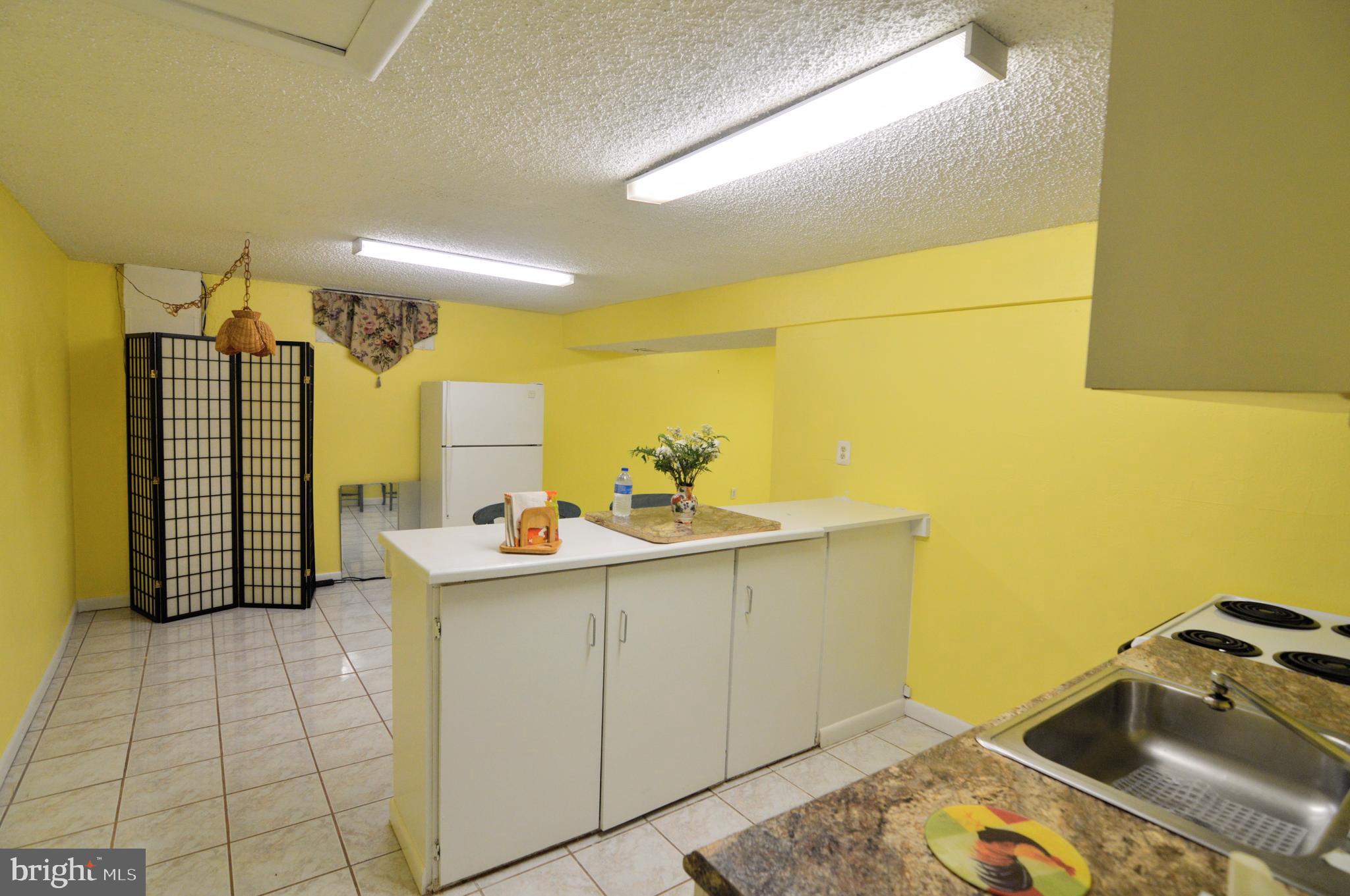6802 Killarney Street Clinton, MD 20735 - Photo 7 of 19 a bathroom with a sink mirror and a shower