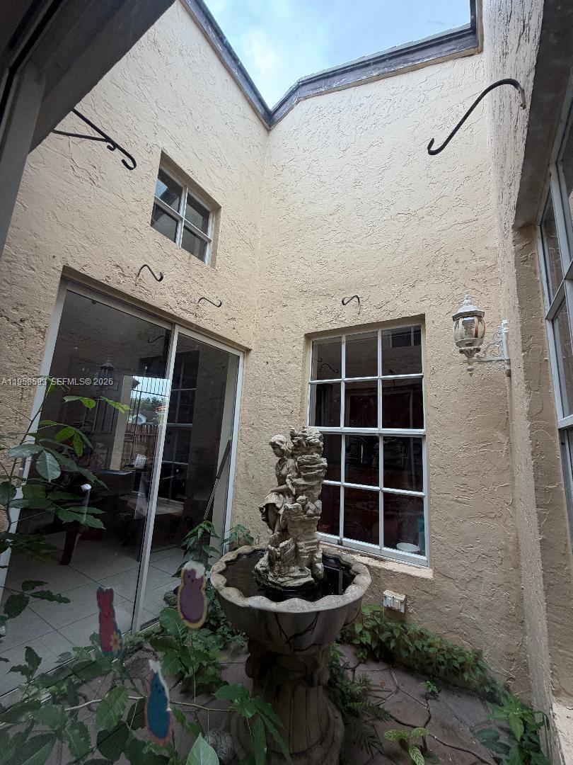 14249 Southwest 103rd Terrace Miami, FL 33186 - Photo 13 of 14 a front view of a house with a yard