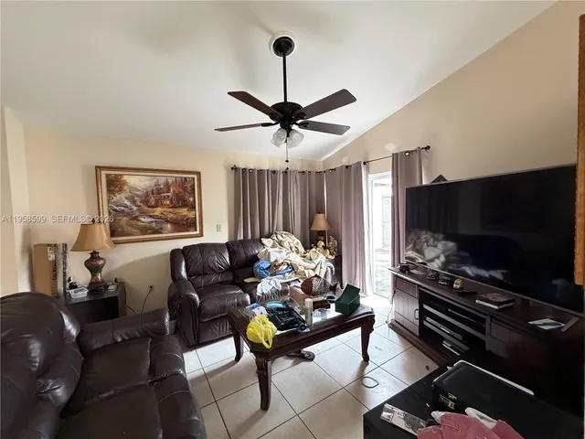 a kitchen with a sink a stove and a refrigerator