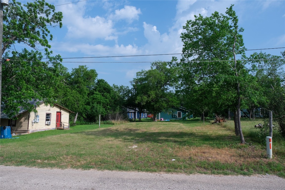602 Alley A Street Elgin, TX 78621 - Photo 7 of 7 a front view of a house with a yard