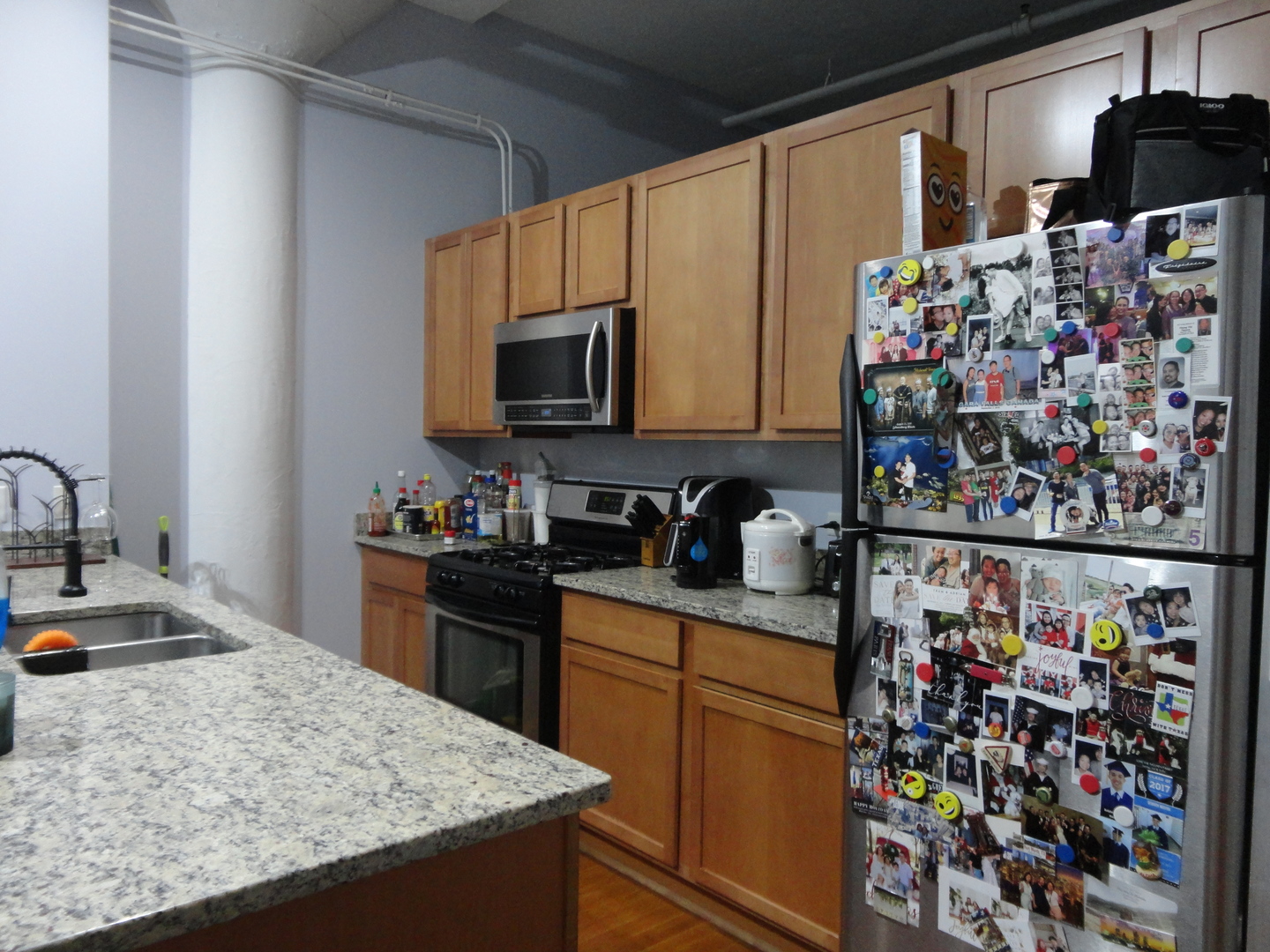 2323 West Pershing Road, Unit 237 Chicago, IL 60609 - Photo 13 of 22 a kitchen with stainless steel appliances granite countertop a sink stove and refrigerator
