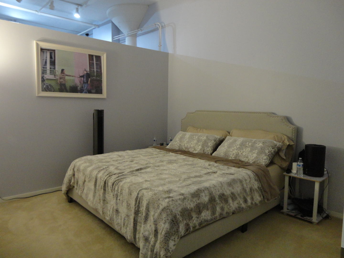 2323 West Pershing Road, Unit 237 Chicago, IL 60609 - Photo 16 of 22 a bed sitting in a bedroom next to a window