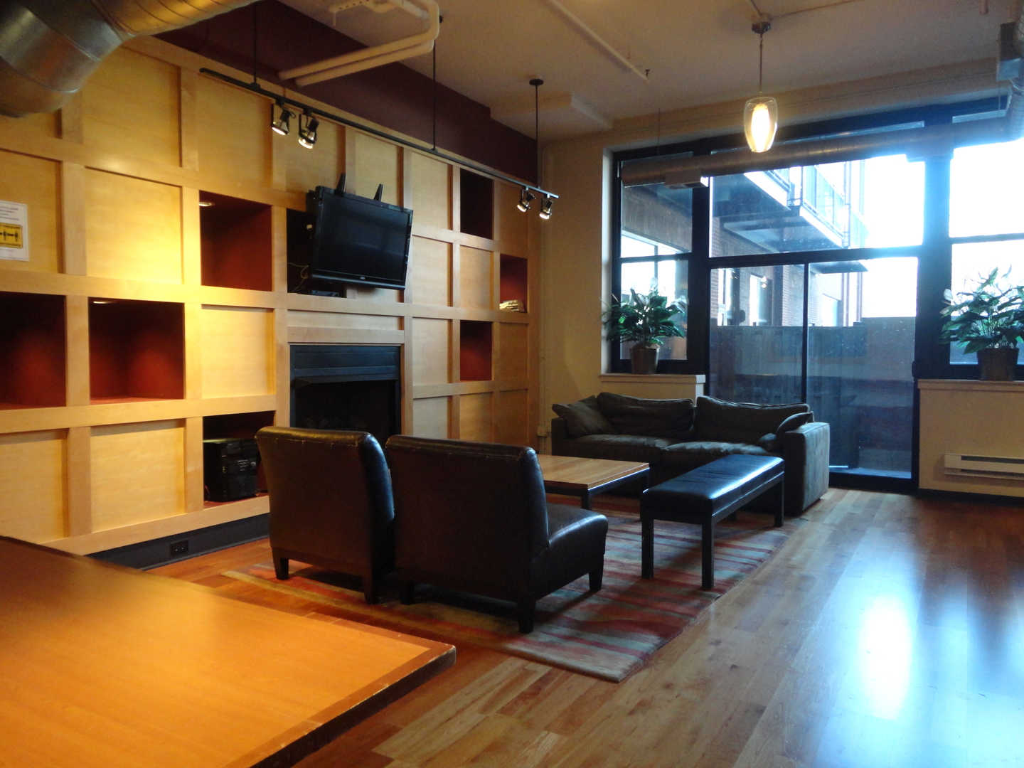 2323 West Pershing Road, Unit 237 Chicago, IL 60609 - Photo 4 of 22 a living room with furniture fireplace and flat screen tv