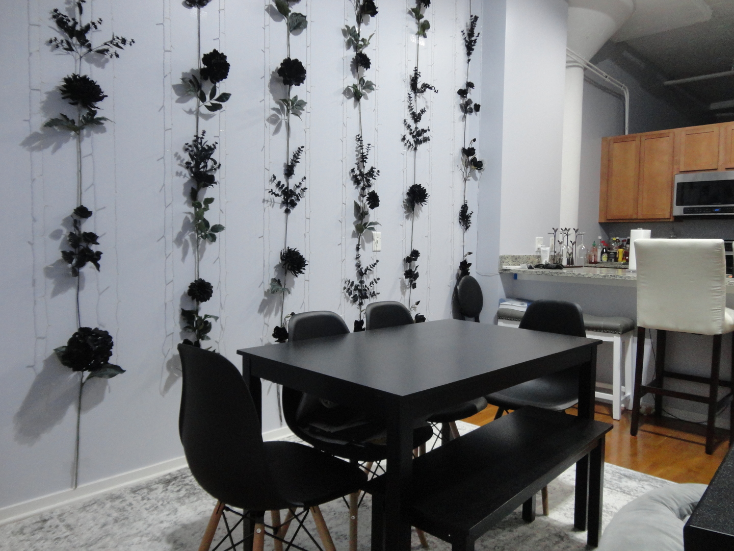 2323 West Pershing Road, Unit 237 Chicago, IL 60609 - Photo 7 of 22 a view of a dining room with furniture and wooden floor