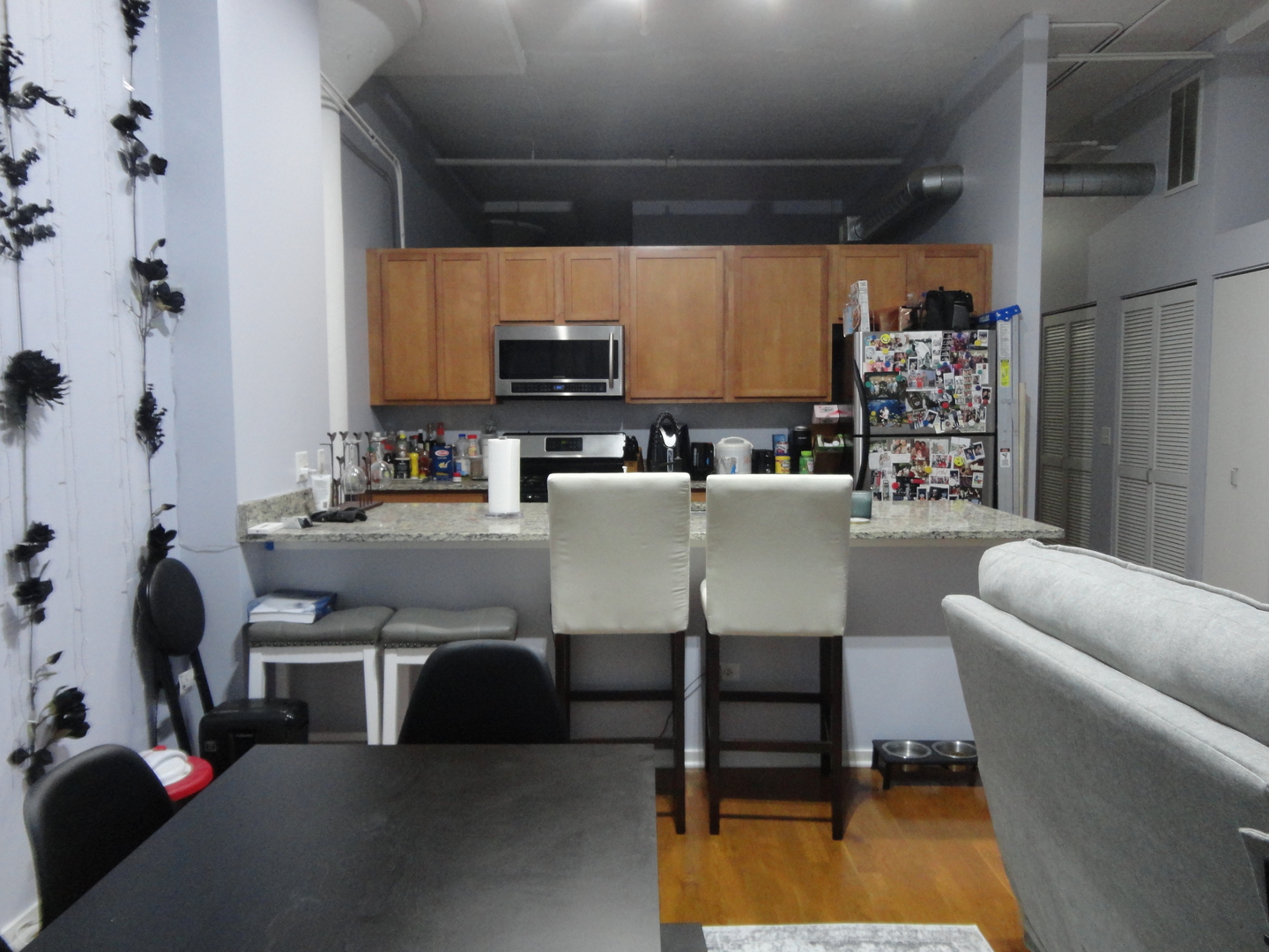 2323 West Pershing Road, Unit 237 Chicago, IL 60609 - Photo 9 of 22 a living room with furniture a window and a flat screen tv