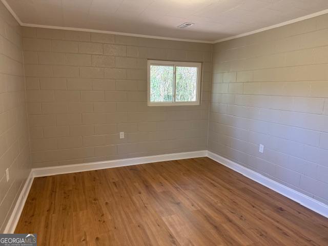 206 Sycamore Way Clarkesville, GA 30523 - Photo 11 of 19 a view of an empty room with wooden floor and a window