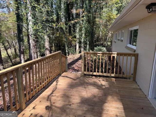 a view of wooden balcony with outdoor space