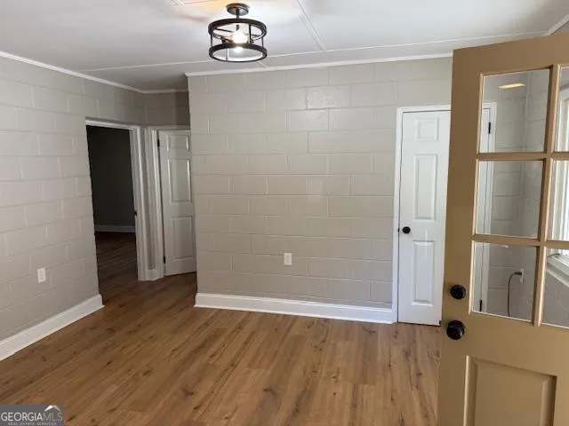 a kitchen with granite countertop a sink stove and refrigerator