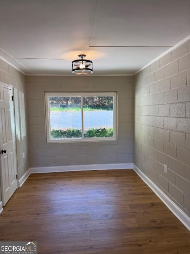 206 Sycamore Way Clarkesville, GA 30523 - Photo 4 of 19 a view of an empty room with wooden floor and a window