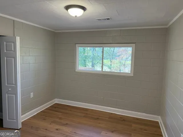 a bathroom with a granite countertop sink toilet a mirror and bathtub