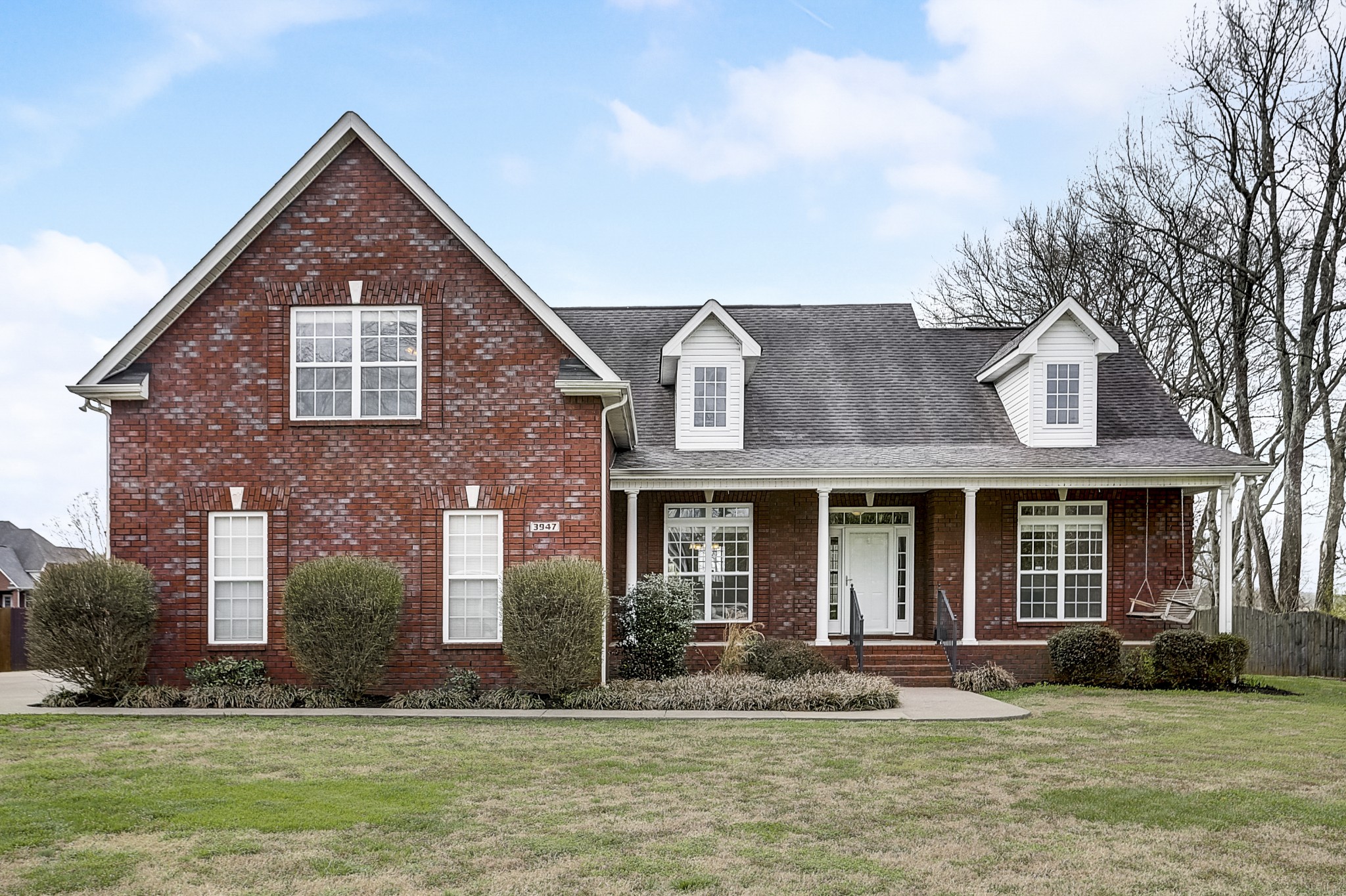 front view of a house with a yard