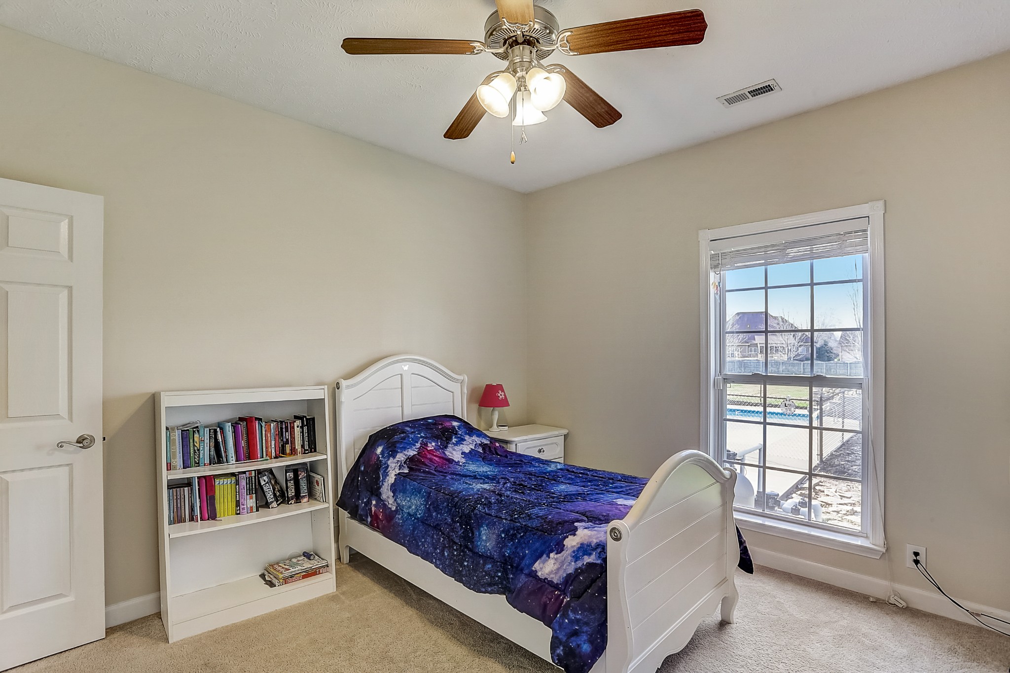 3947 Rowland Road Murfreesboro, TN 37128 - Photo 16 of 50 a bed room with a bed and a book shelf