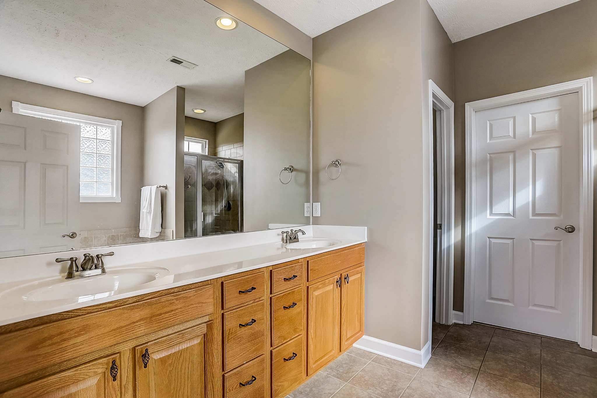 3947 Rowland Road Murfreesboro, TN 37128 - Photo 26 of 50 a spacious bathroom with a double vanity sink and a mirror