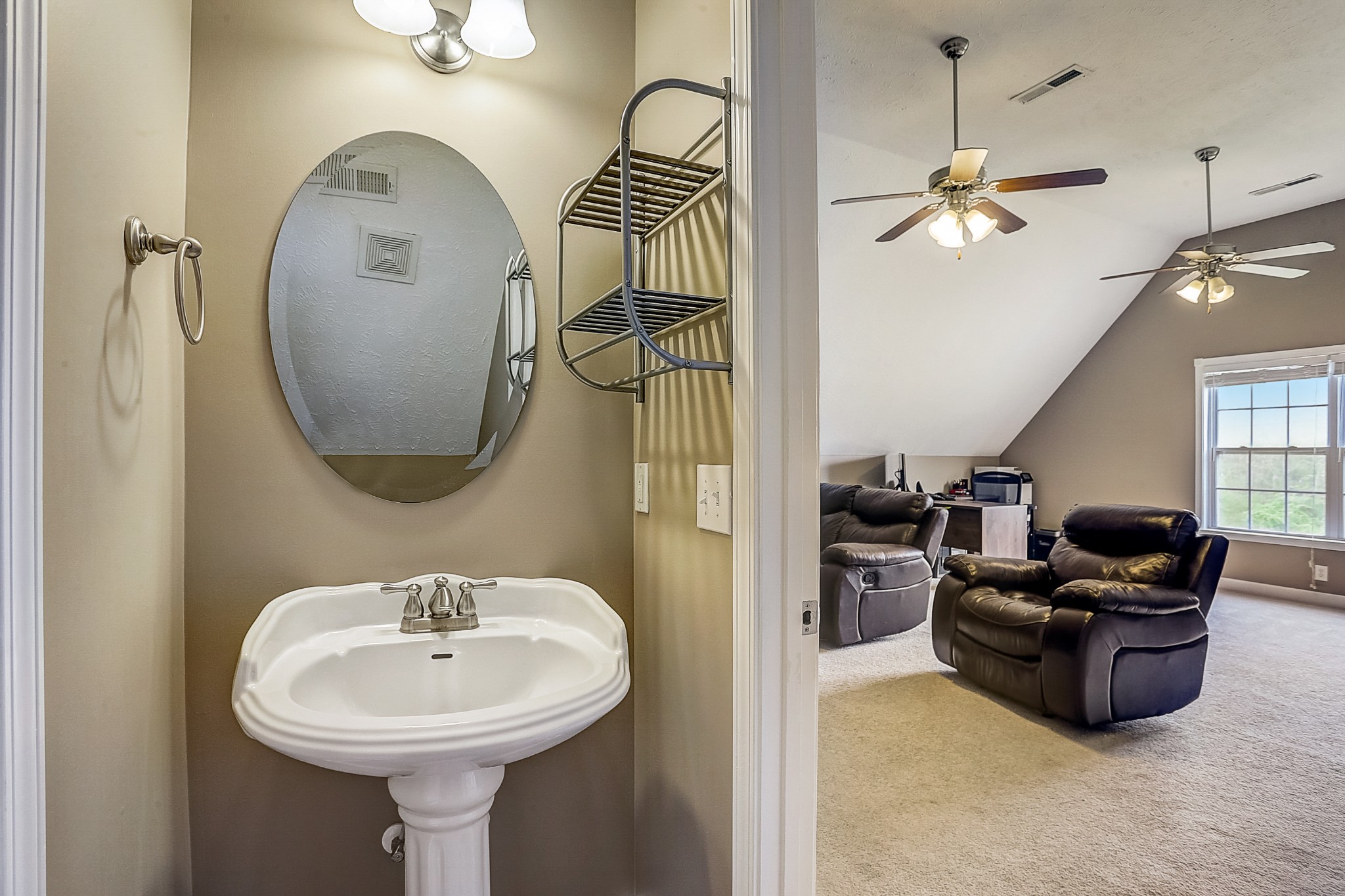 3947 Rowland Road Murfreesboro, TN 37128 - Photo 32 of 50 a bathroom with a sink a mirror a lamp and a window