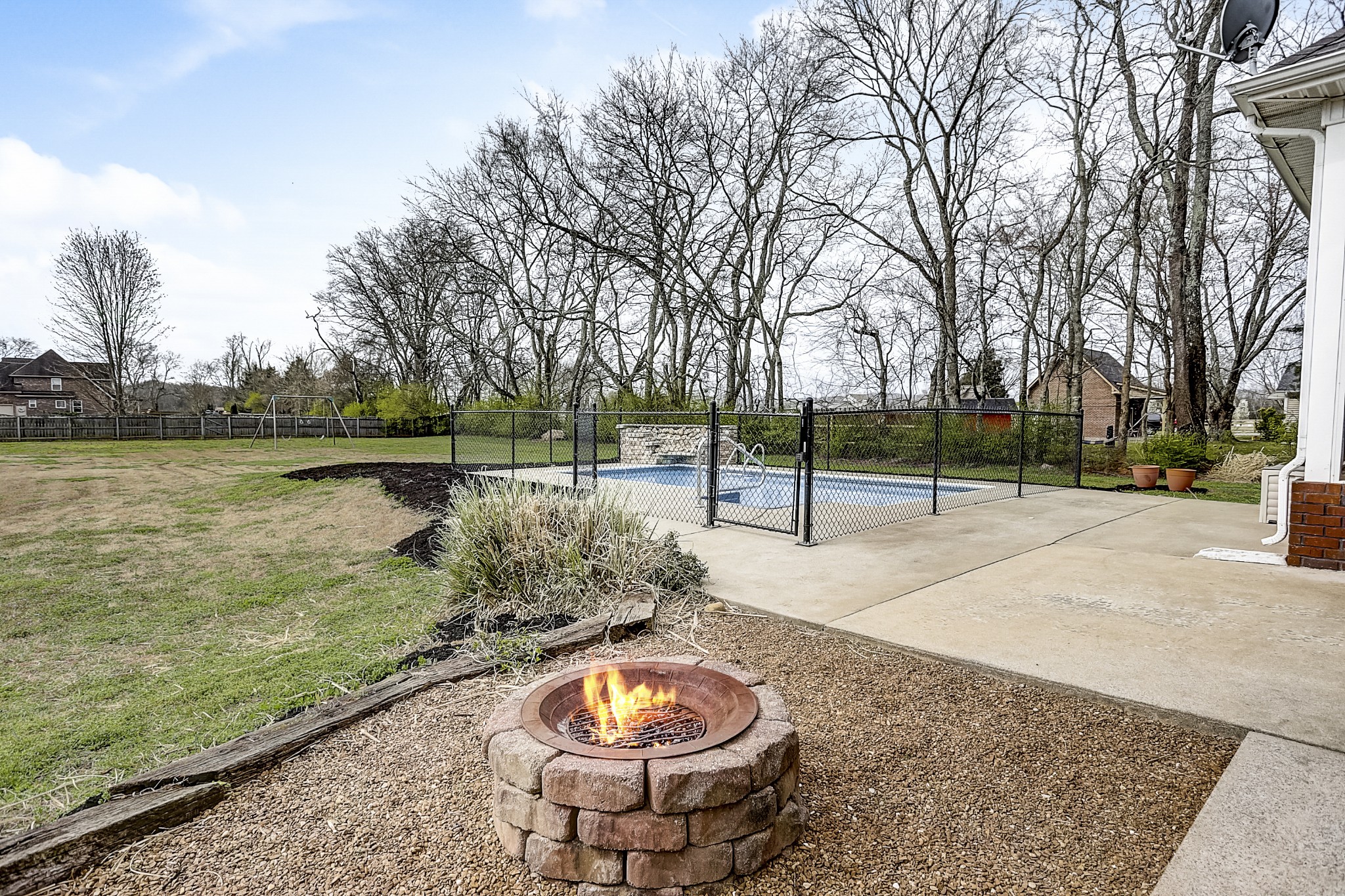 3947 Rowland Road Murfreesboro, TN 37128 - Photo 39 of 50 a backyard of water with a fountain and large trees