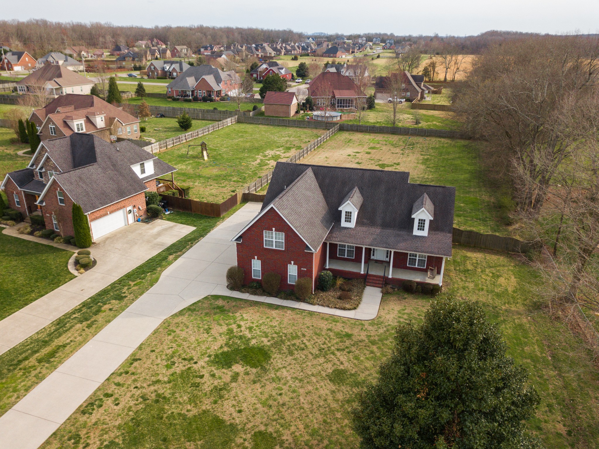3947 Rowland Road Murfreesboro, TN 37128 - Photo 44 of 50 an aerial view of a house with a garden and lake view