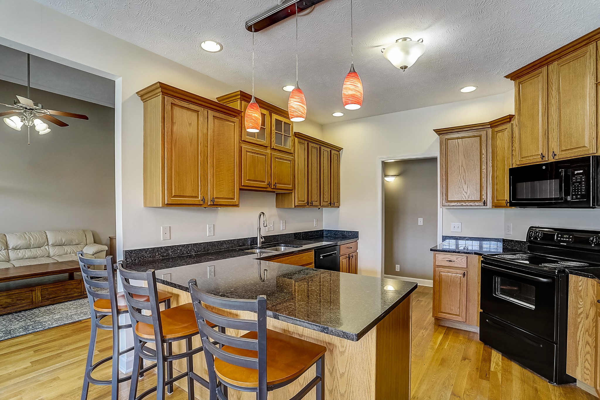 3947 Rowland Road Murfreesboro, TN 37128 - Photo 10 of 50 a kitchen that has a table chair and wooden cabinets