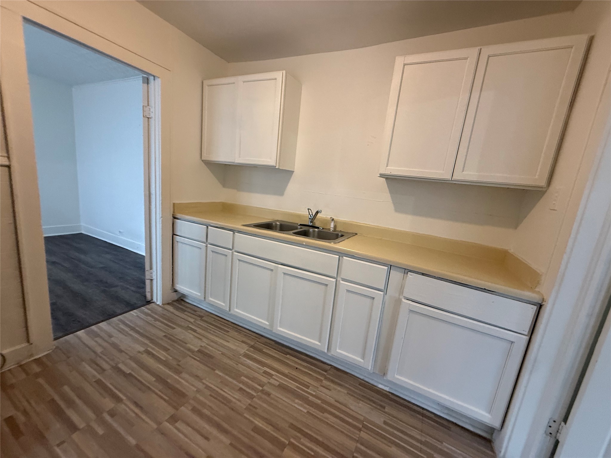 7002 Vandeman Street, Unit 5 Houston, TX 77087 - Photo 5 of 12 a kitchen with a sink and cabinets