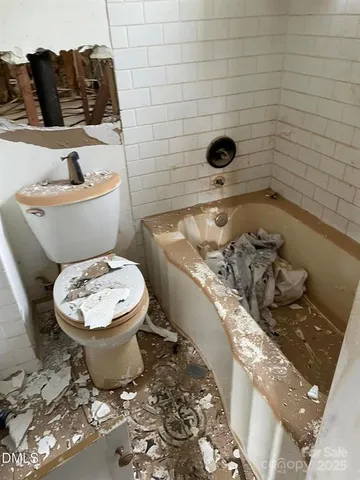 a bathroom with a toilet and a sink