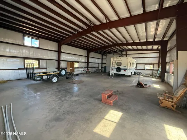 a view of parking garage with parked area