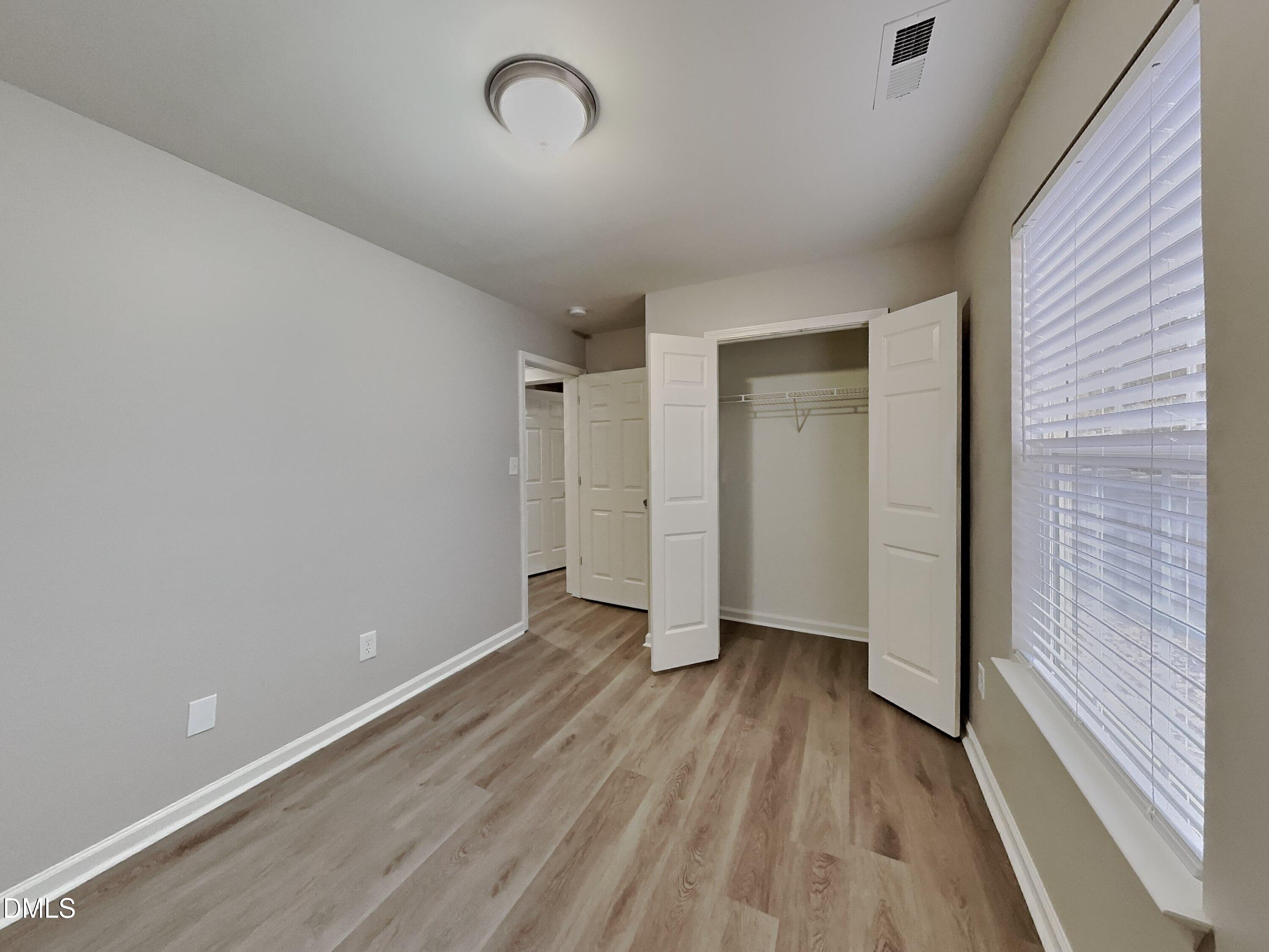 3665 Watkins Ridge Court Raleigh, NC 27616 - Photo 12 of 15 a view of an empty room with wooden floor