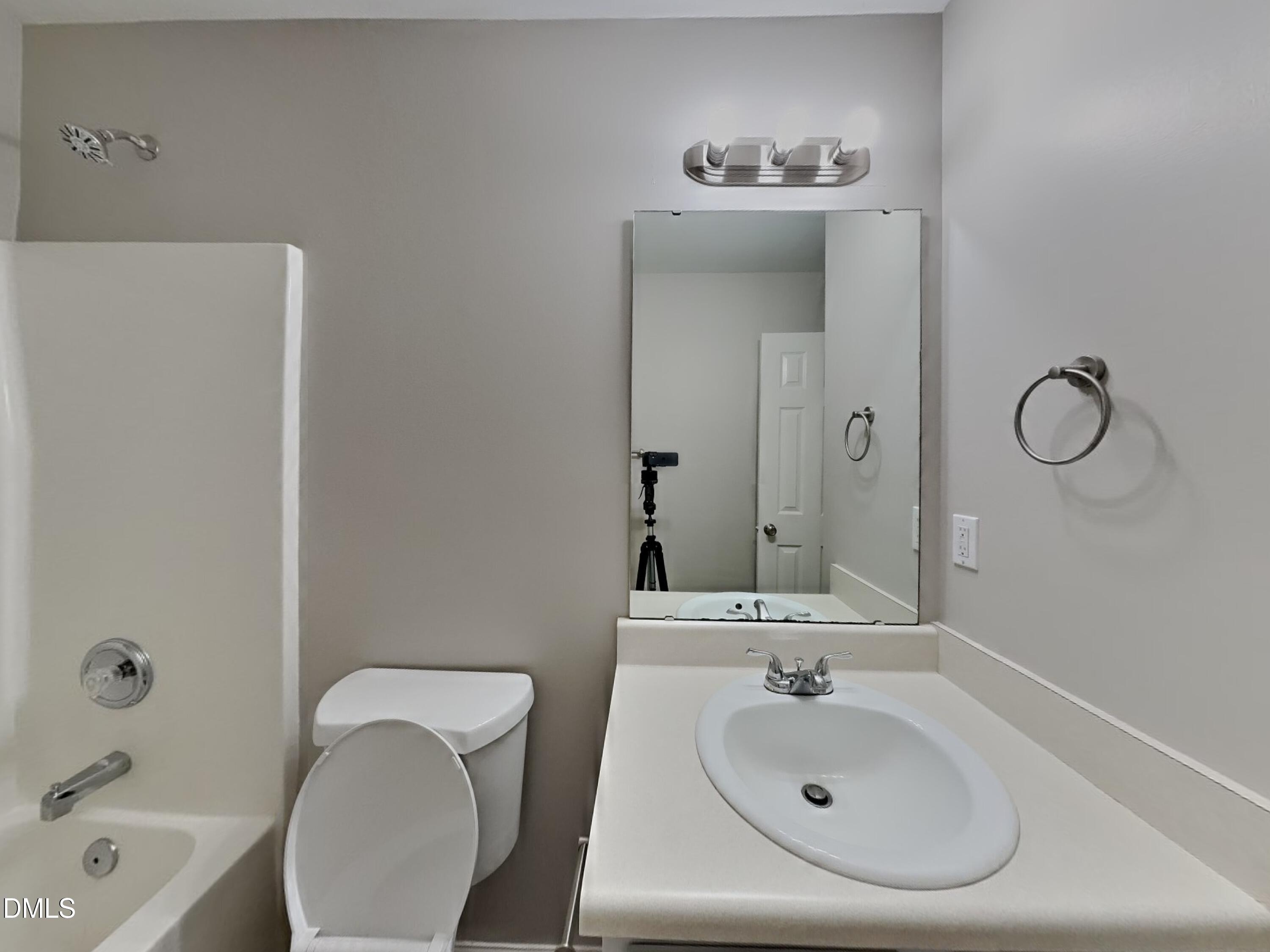 3665 Watkins Ridge Court Raleigh, NC 27616 - Photo 14 of 15 a bathroom with a sink a toilet and shower