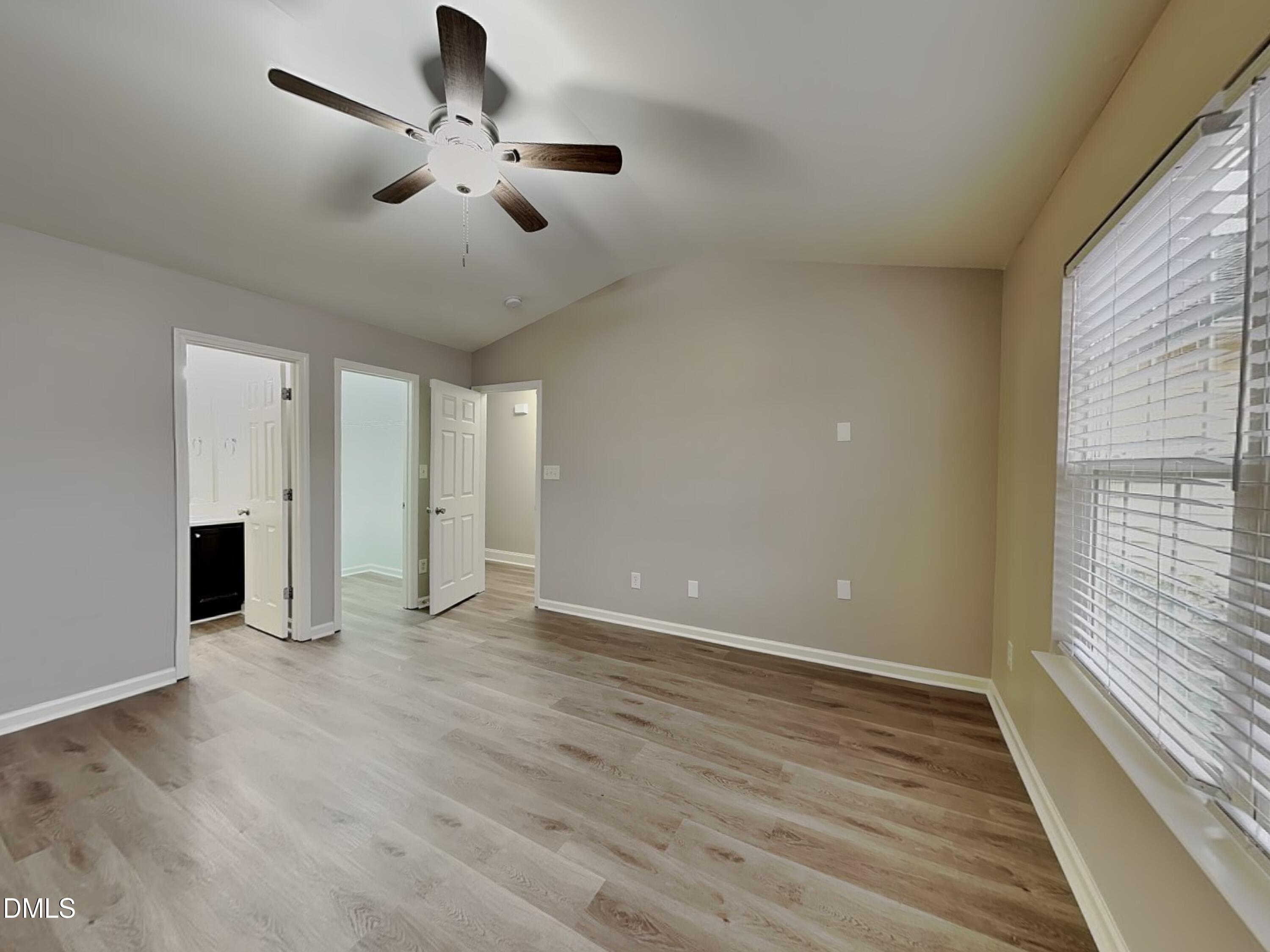 3665 Watkins Ridge Court Raleigh, NC 27616 - Photo 7 of 15 wooden floor in an empty room with a window