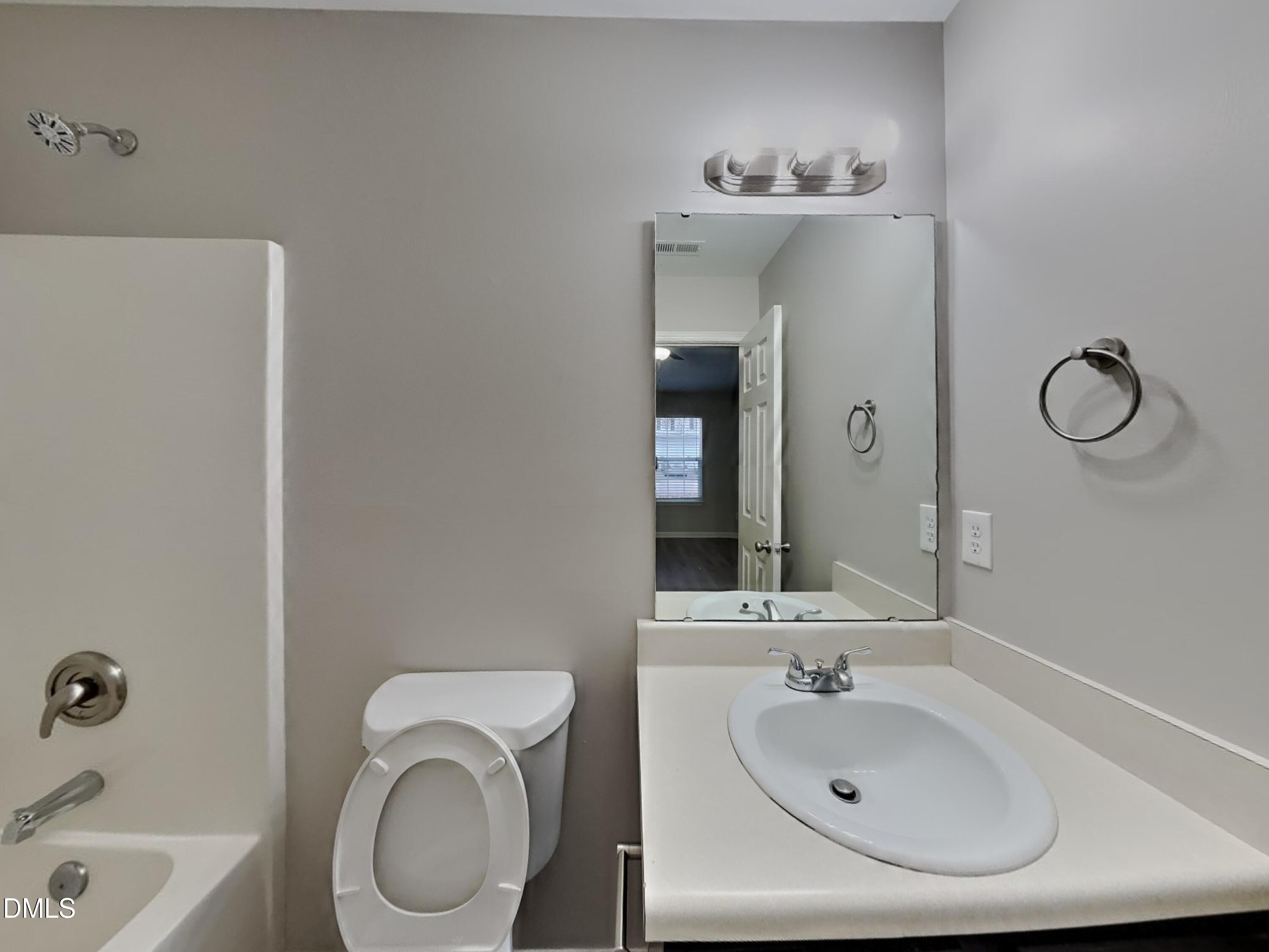 3665 Watkins Ridge Court Raleigh, NC 27616 - Photo 8 of 15 a bathroom with a sink a toilet and bathtub