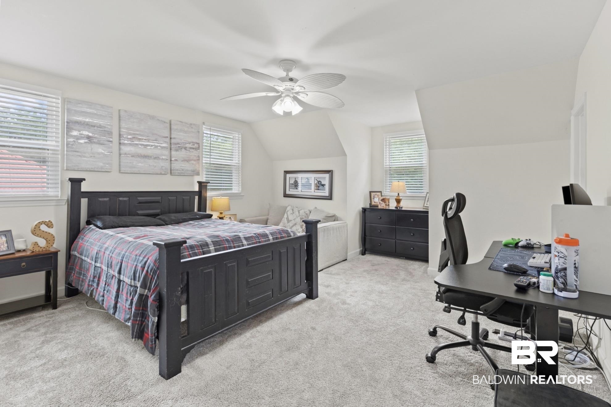 12171 Marguerite Drive Coden, AL 36523 - Photo 19 of 44 Spacious room featuring light-colored carpet flooring and multiple windows with blinds