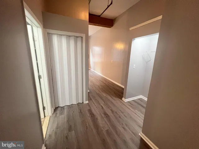 a bathroom with a sink a toilet a mirror and shower