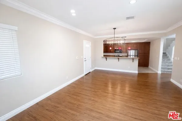 a view of a kitchen with a sink and microwave