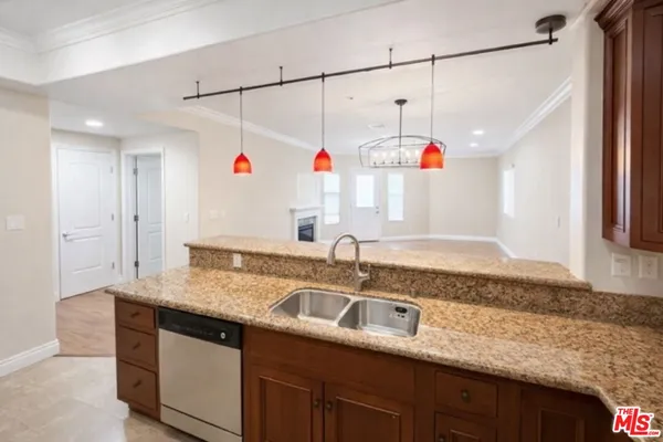 a kitchen with counter top space a sink and cabinets