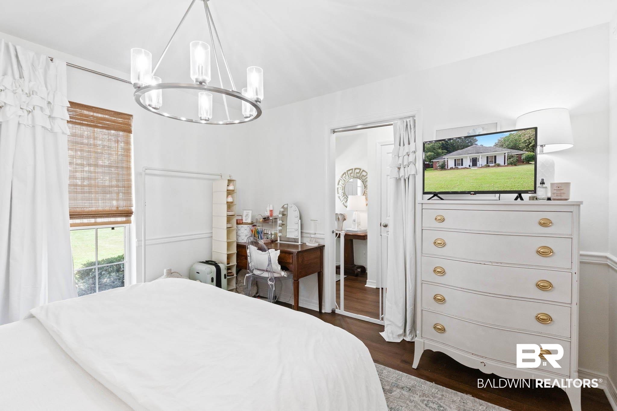 20685 Lowry Drive Fairhope, AL 36532 - Photo 37 of 48 Bedroom featuring dark wood-type flooring and a chandelier