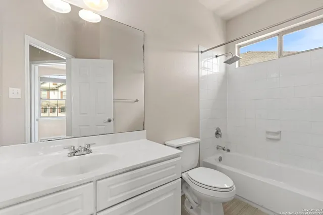 a bathroom with a sink a toilet and a bathtub