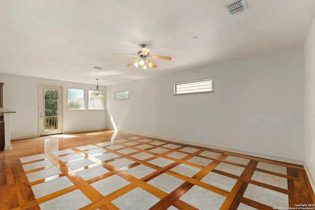 a view of an empty room with a window