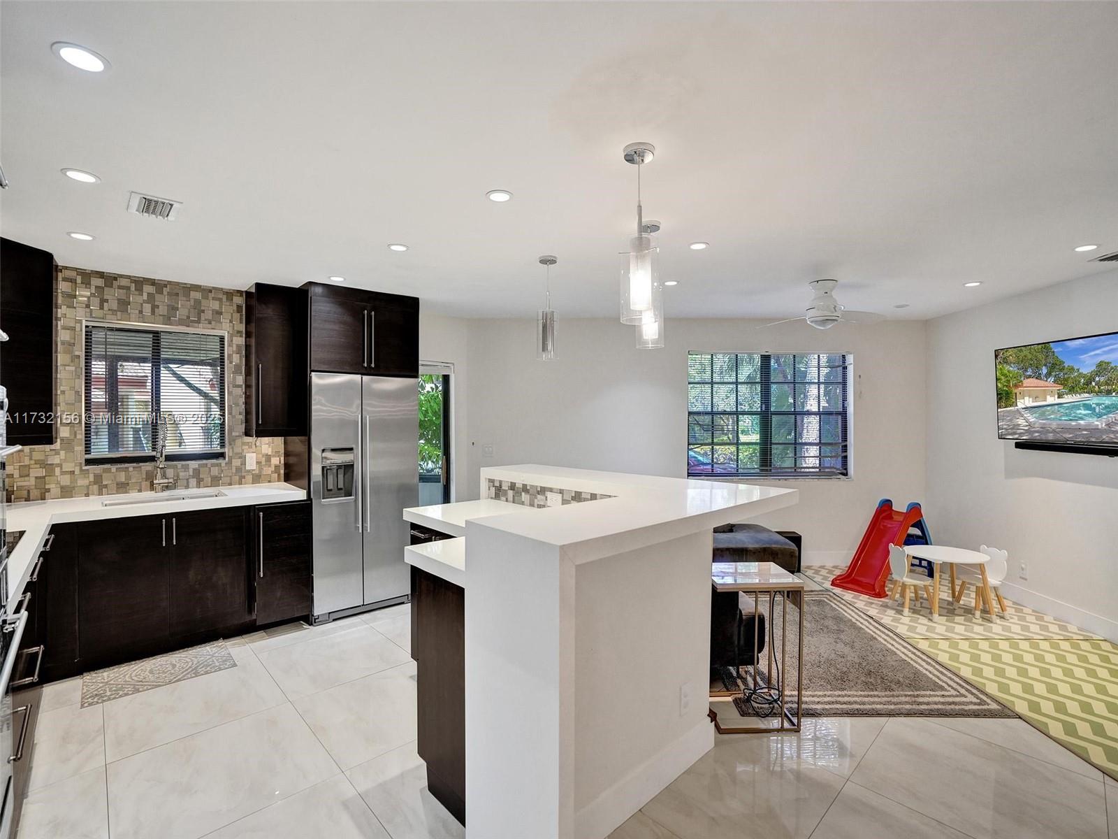 3507 Green Leaf Circle, Unit 2004 Hollywood, FL 33021 - Photo 11 of 33 a view of kitchen with stainless steel appliances kitchen island hardwood floor sink stove and oven