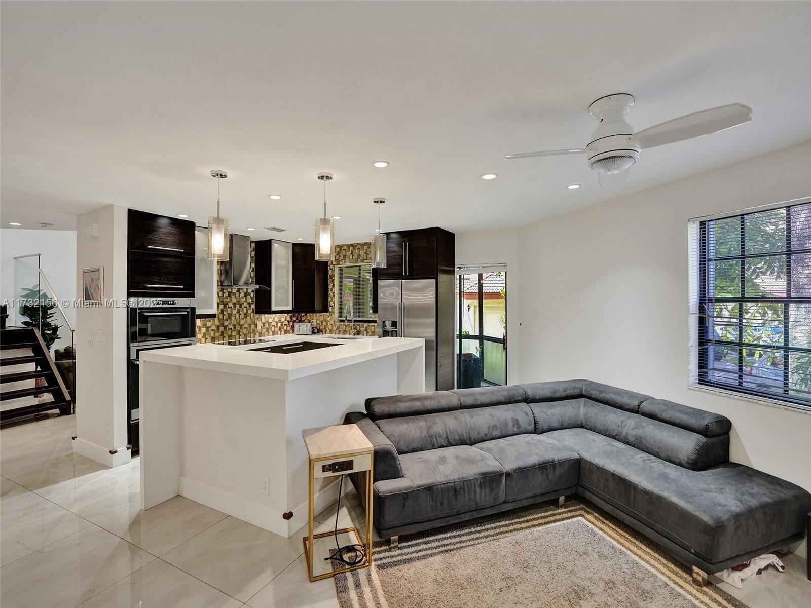 3507 Green Leaf Circle, Unit 2004 Hollywood, FL 33021 - Photo 14 of 33 a living room with furniture and kitchen view