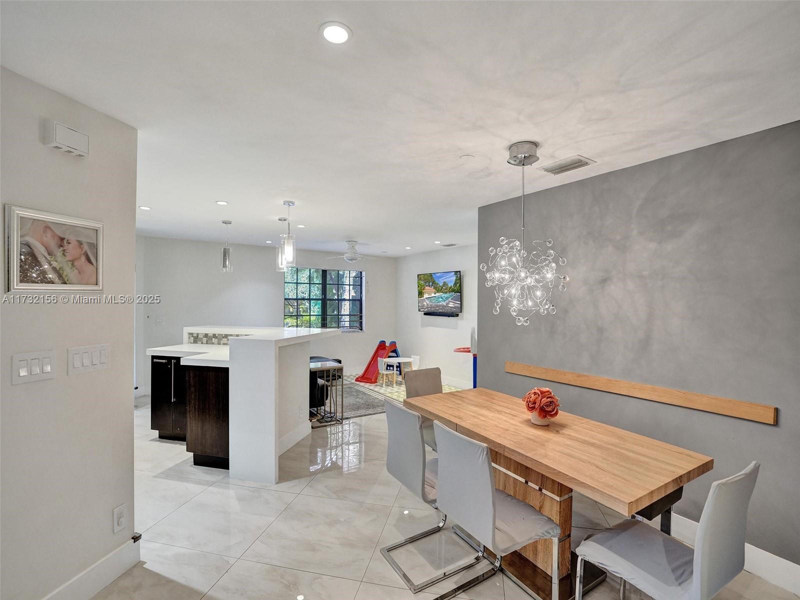 3507 Green Leaf Circle, Unit 2004 Hollywood, FL 33021 - Photo 15 of 33 a room with furniture and window