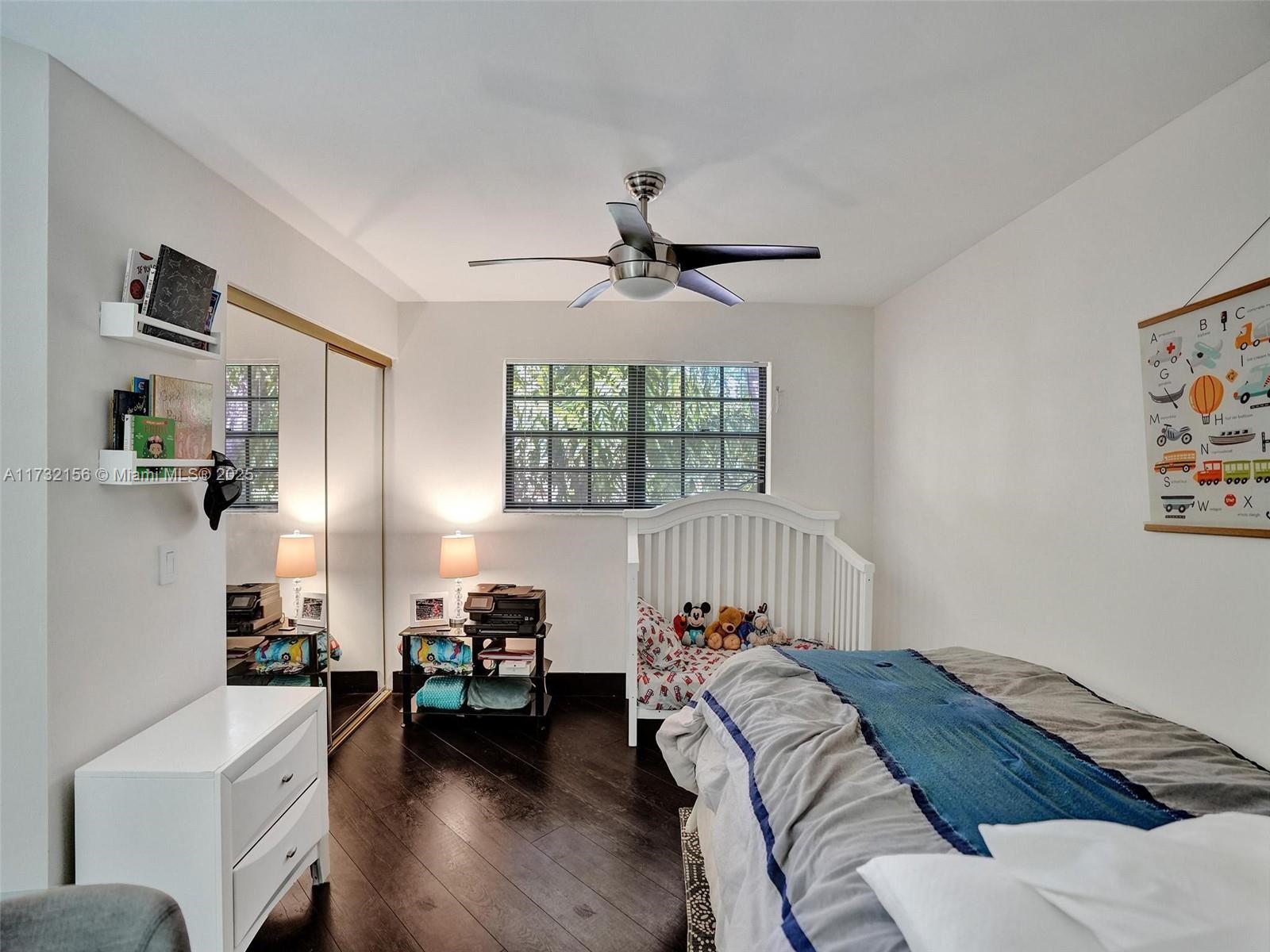 3507 Green Leaf Circle, Unit 2004 Hollywood, FL 33021 - Photo 27 of 33 a bedroom with furniture and a window