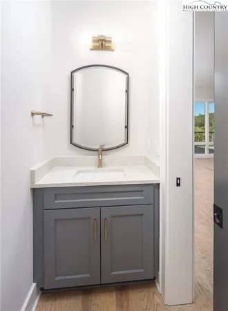 a bathroom with a sink and a mirror