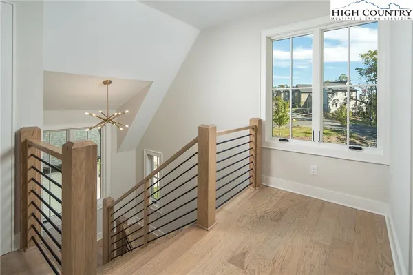 a view of entryway with stairs and wooden floor