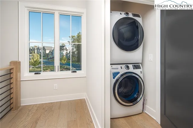 a view of a hallway with washer and dryer