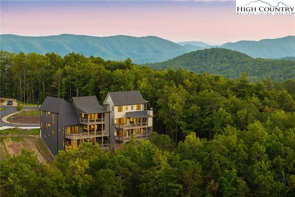a view of a town with mountains in the background